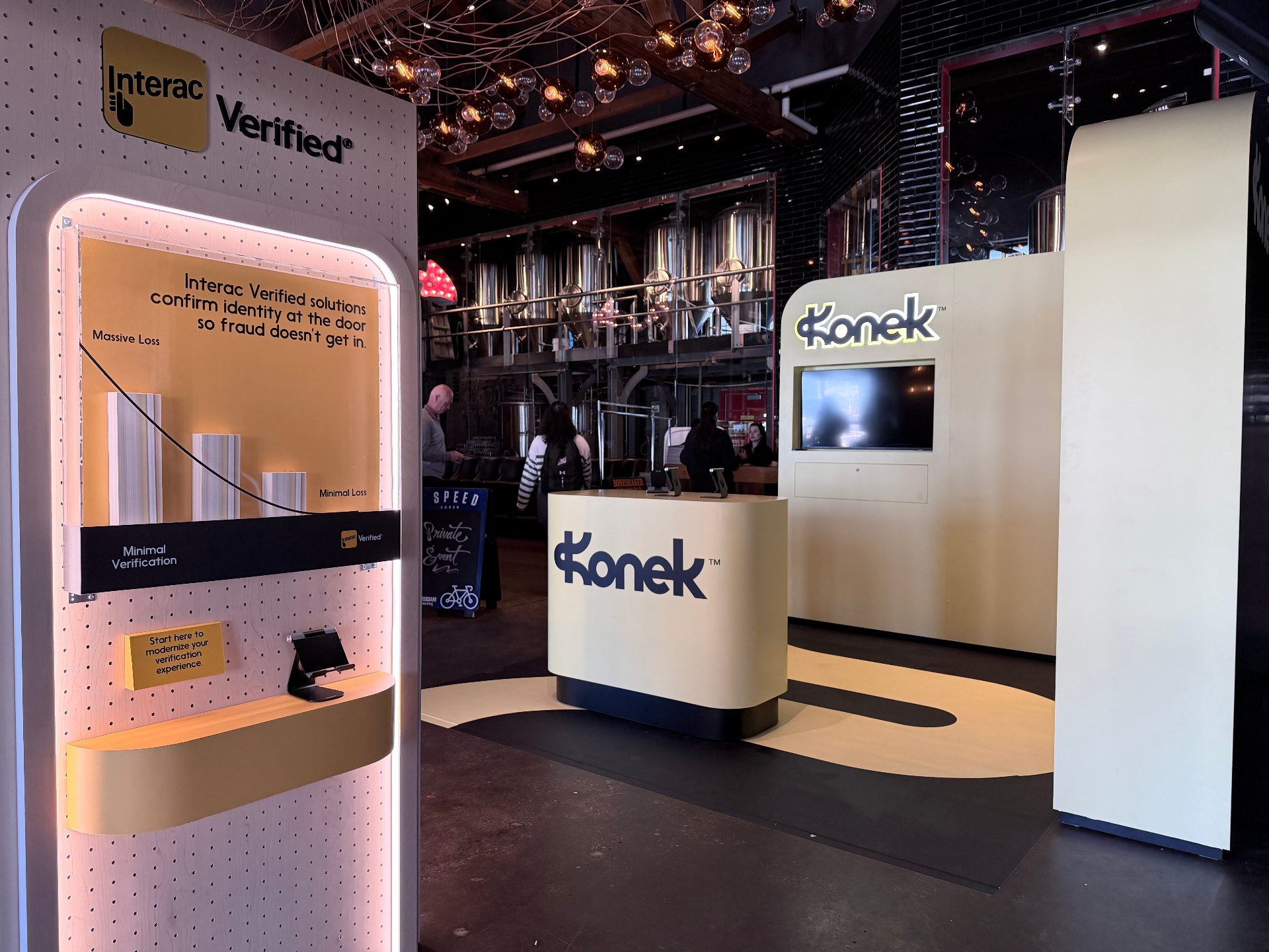 Konek and Interac Verified activation at Pier 4 with curved Konek counter and Interac Verified kiosk