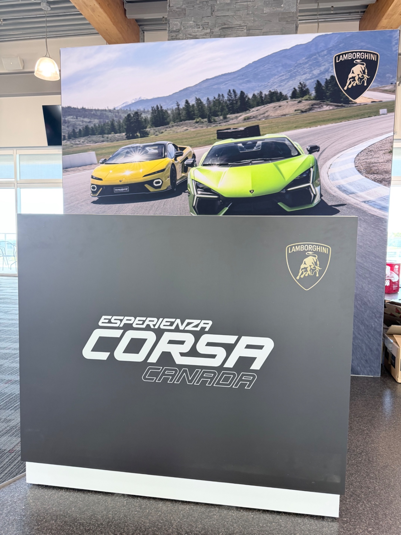 Lamborghini Esperienza Corsa Canada hero photo wall and branded counter inside the Canadian Tire Motorsport Park clubhouse