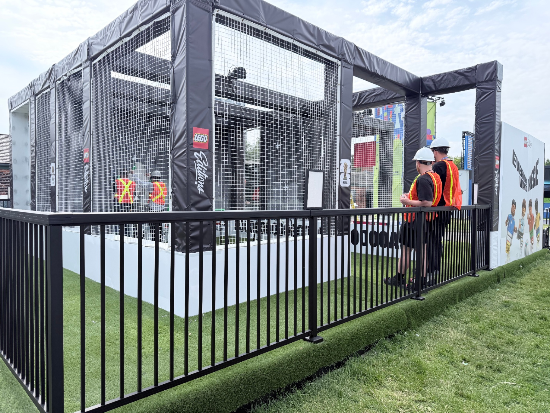 Inflatable LEGO Editions soccer cage with netting and FIFA 26 branding during install