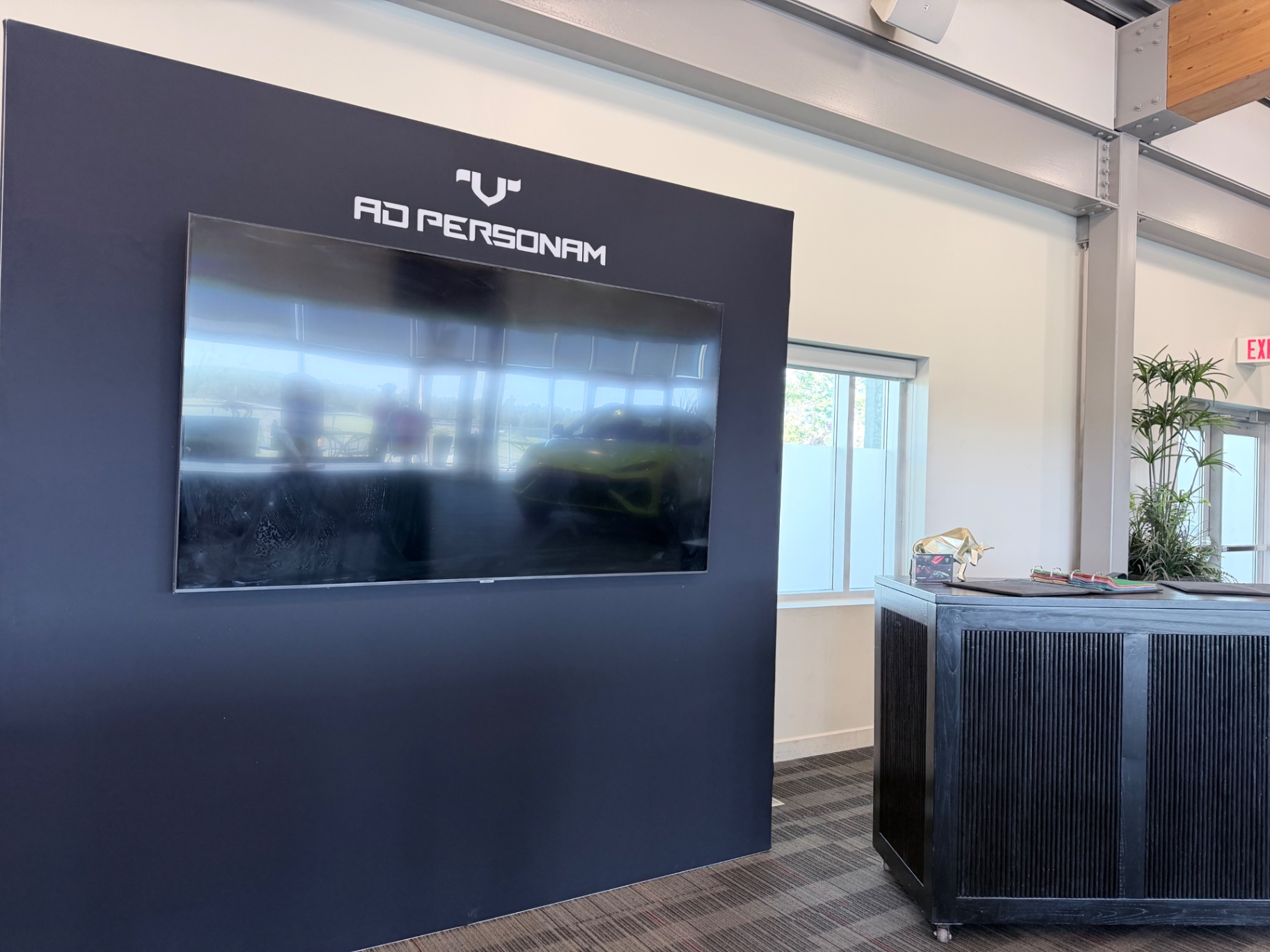 Lamborghini Ad Personam configuration wall with integrated screen inside the Esperienza Corsa Canada hospitality environment